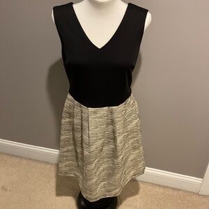 Ladies sleeveless black dress with patterned skirt